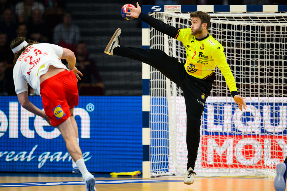 Spain goalkeeper trying to save the shot