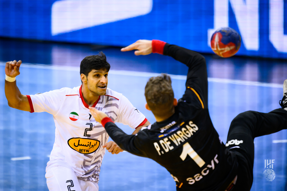 Iran goalkeeper shooting with the ball heading towards the goal, passing away from the goalkeeper