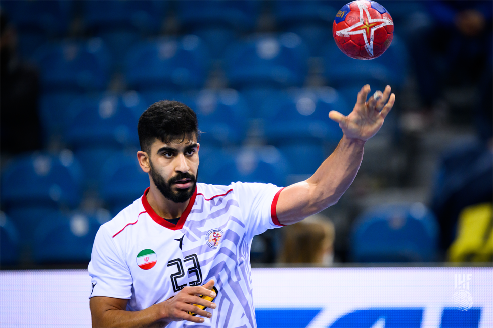 Iran player passing the ball