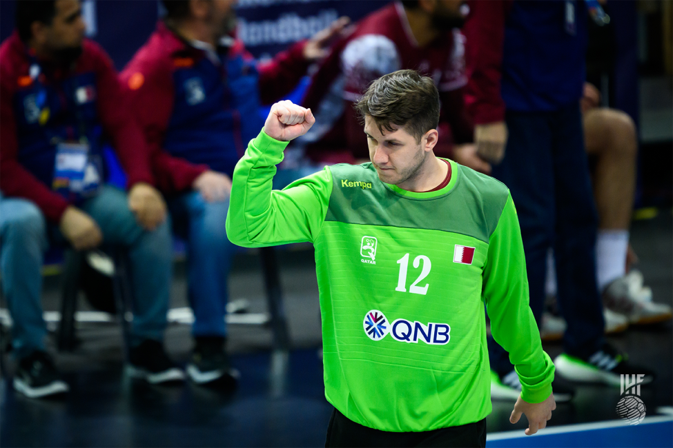 Qatar goalkeeper celebrating