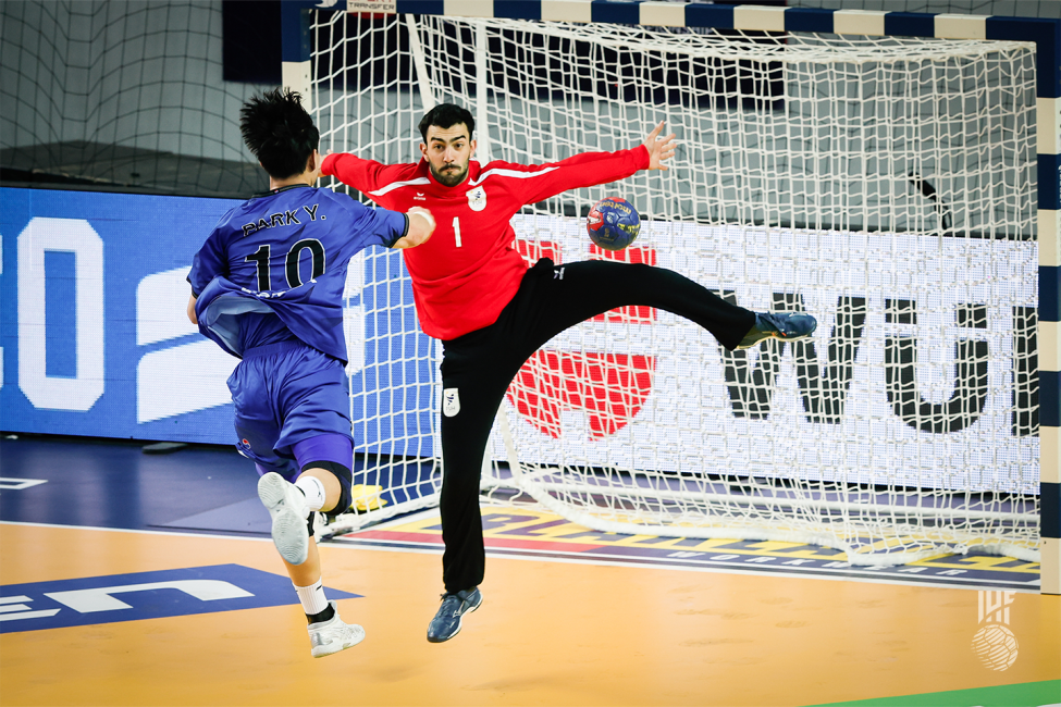 Uruguay goalkeeper trying to prevent a shot