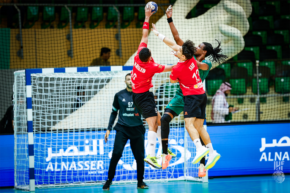 Al Ahly players reaching the ball in the air