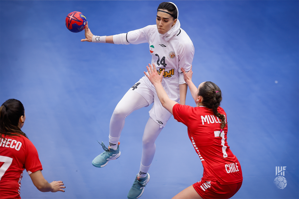 Iran player passing the ball