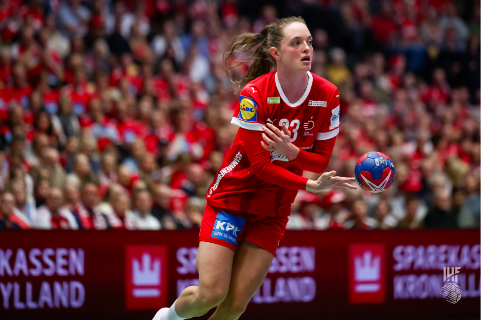 Denmark player passing the ball