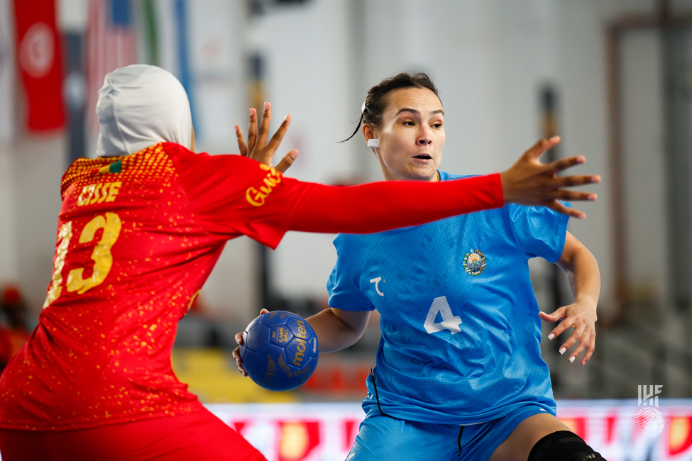 Uzbekistan player attacking