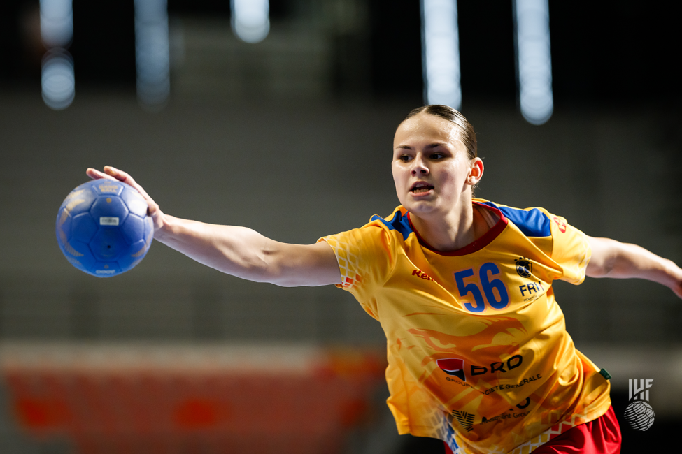 Romania player passing the ball