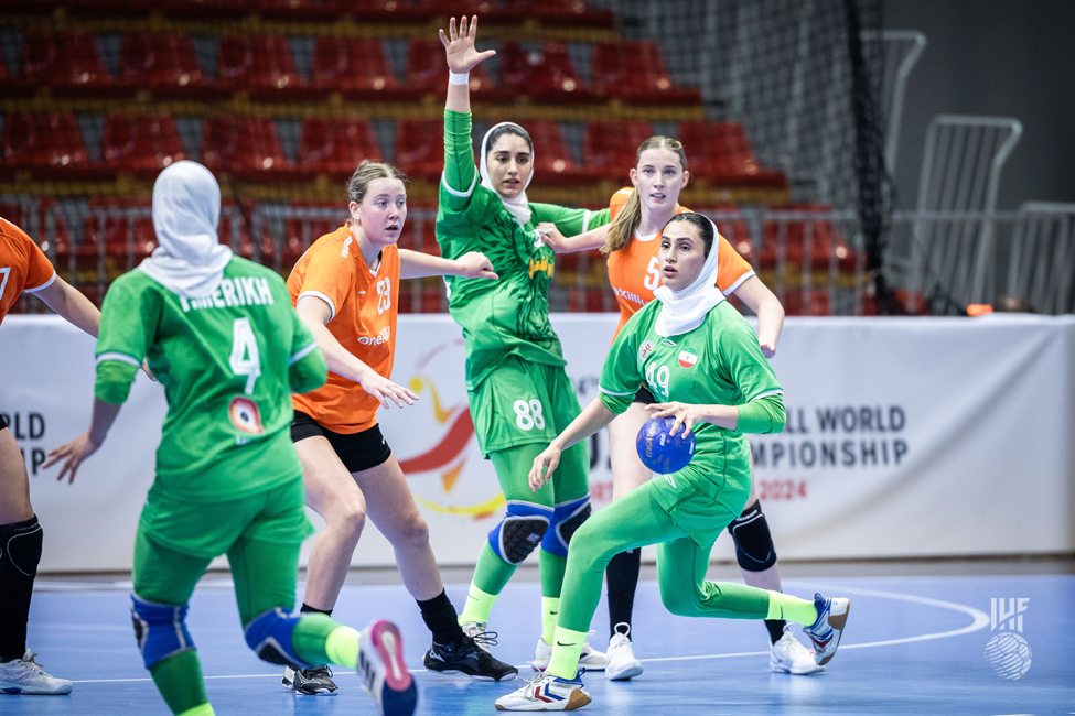 Iran player passing the ball