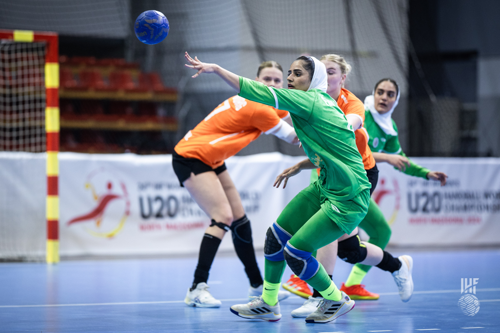 Iran player passing the ball