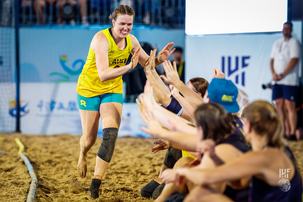 Australia player celebrating with teammates 