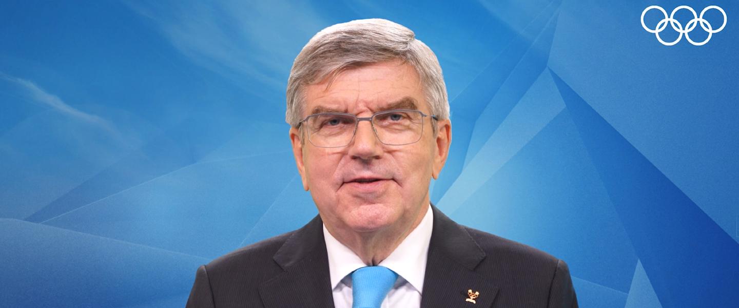 IOC President Dr Thomas Bach congratulates IHF